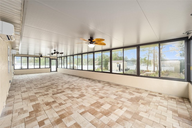 unfurnished sunroom with a ceiling fan and a wall mounted AC