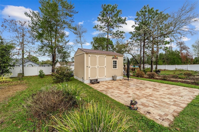 view of shed with a fenced backyard