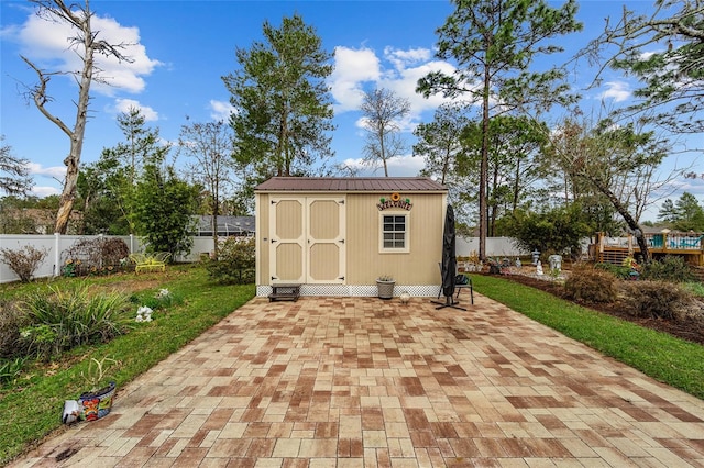 view of shed featuring a fenced backyard