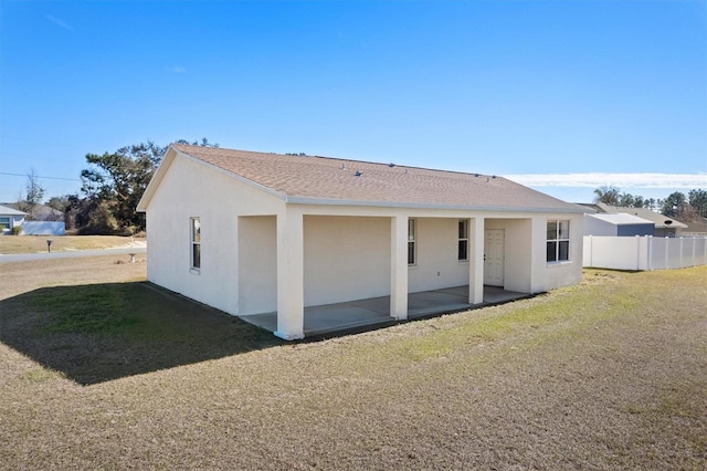 exterior space with a patio area and a lawn