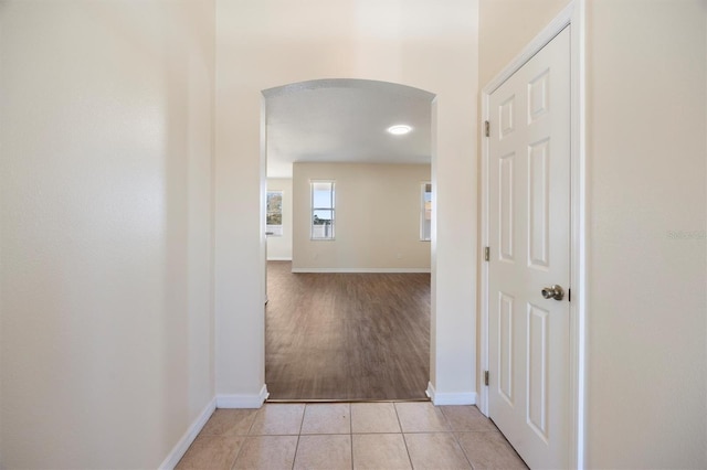 corridor with light tile patterned floors