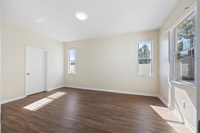 spare room featuring dark hardwood / wood-style floors