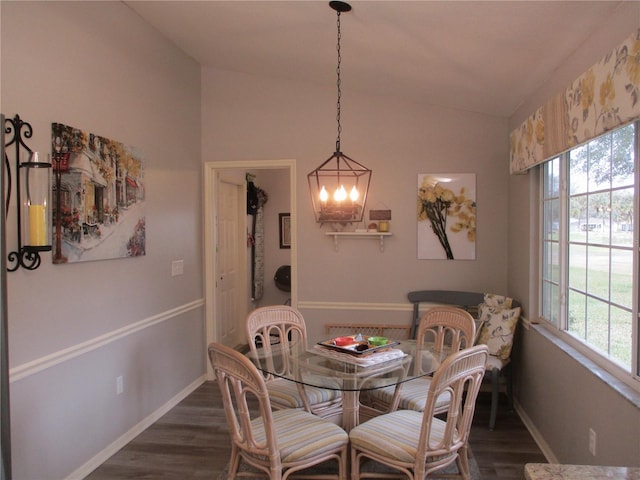 dining room with a wealth of natural light, baseboards, and dark wood-style flooring