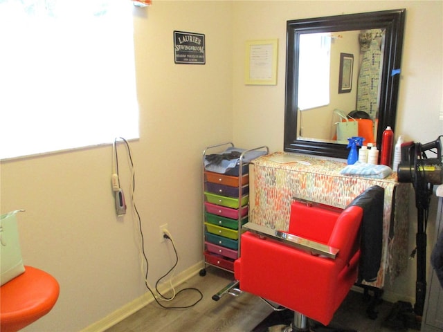 interior space featuring wood finished floors and baseboards