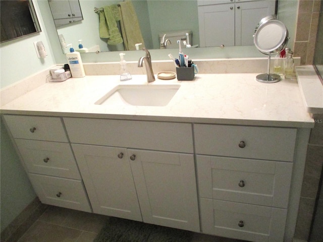 bathroom featuring vanity, toilet, and tile patterned floors