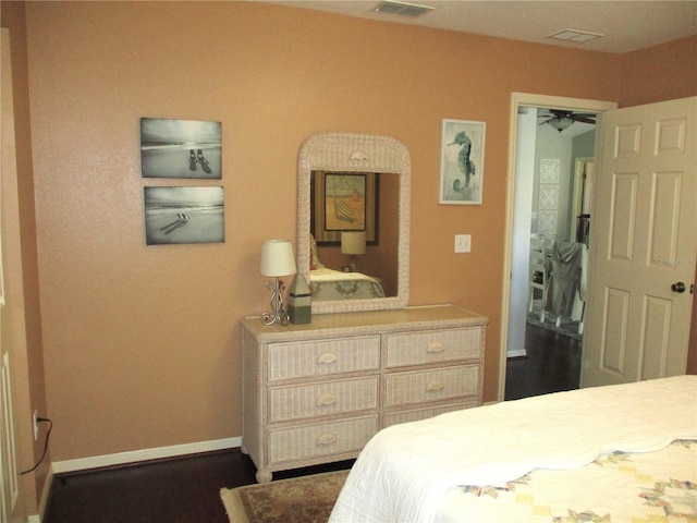 bedroom with visible vents and baseboards