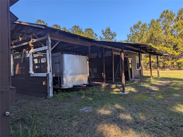 view of outdoor structure featuring a yard