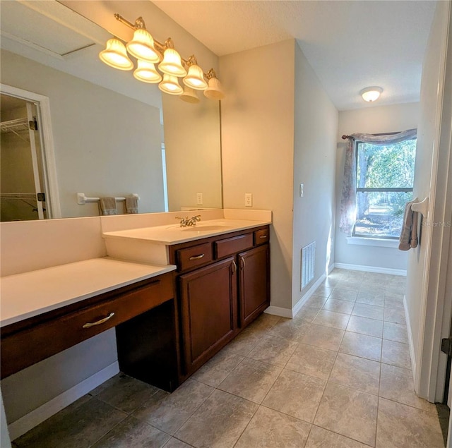 bathroom with vanity and tile patterned floors