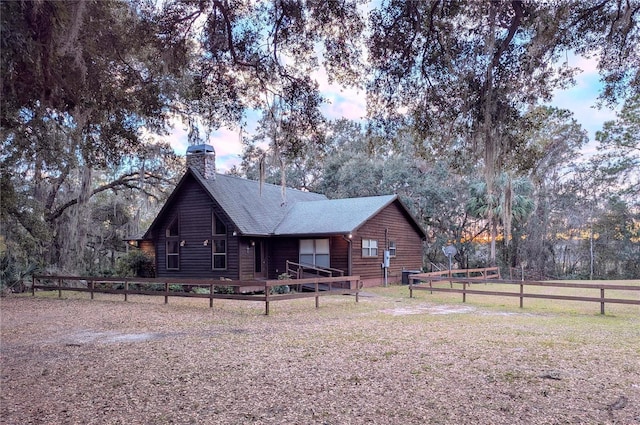 back of house featuring a yard