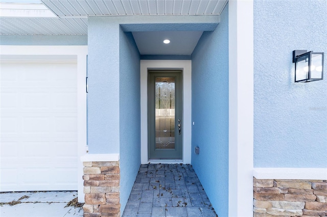 property entrance with a garage