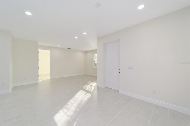 unfurnished room featuring light tile patterned floors