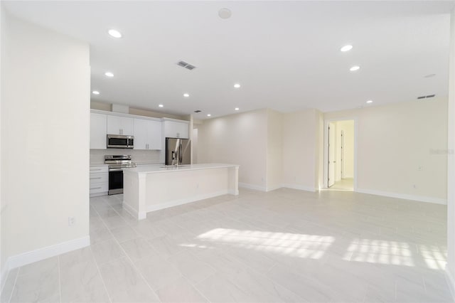 unfurnished living room with light tile patterned flooring