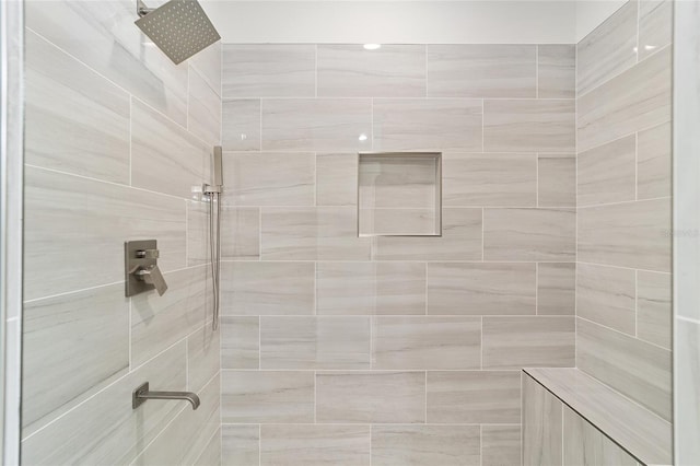 bathroom with tiled shower