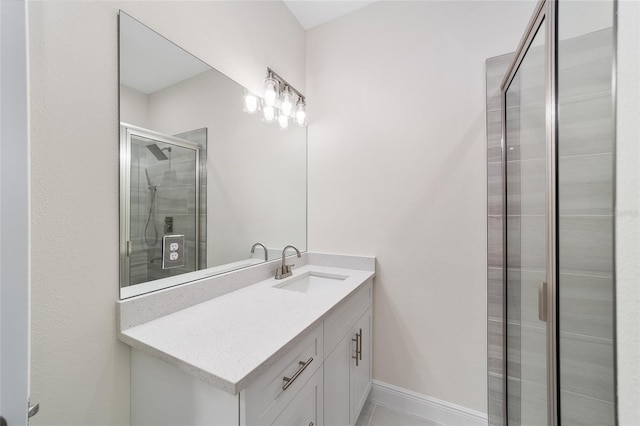 bathroom featuring vanity, tile patterned floors, and walk in shower