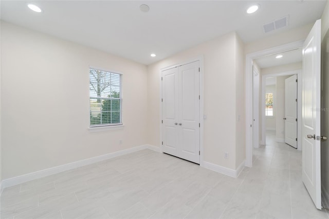 unfurnished bedroom with a closet