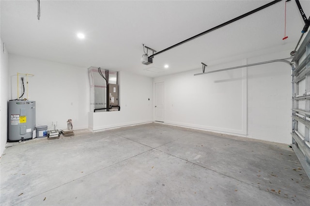 garage with heating unit, a garage door opener, and water heater