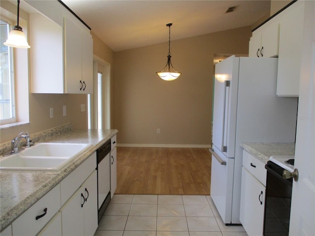 kitchen with white cabinetry, sink, black electric range, and hanging light fixtures