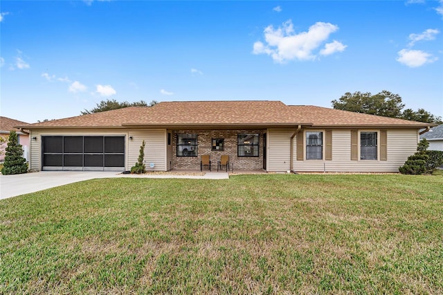 single story home featuring a garage and a front yard