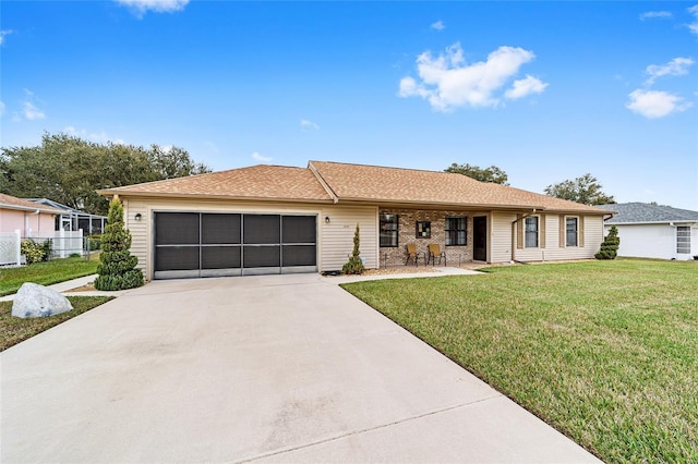 ranch-style home featuring a garage and a front yard