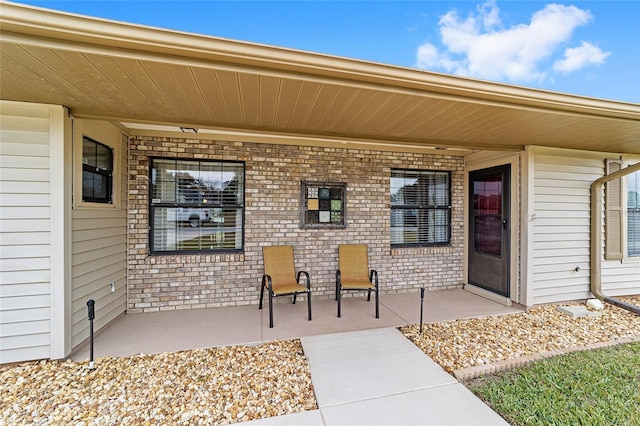 doorway to property featuring a patio area