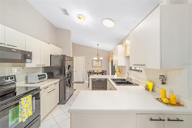 kitchen featuring pendant lighting, white cabinetry, sink, and black appliances