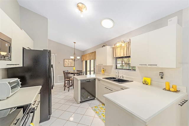 kitchen with sink, white cabinetry, decorative light fixtures, kitchen peninsula, and stainless steel appliances