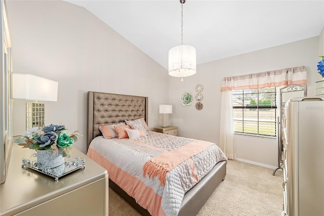 bedroom featuring vaulted ceiling and light carpet