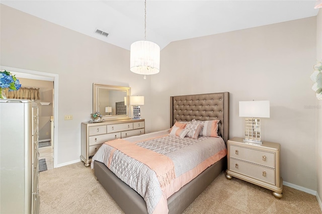 carpeted bedroom featuring lofted ceiling, refrigerator, and a chandelier