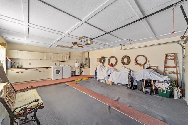 garage with ceiling fan, a garage door opener, and washer and dryer