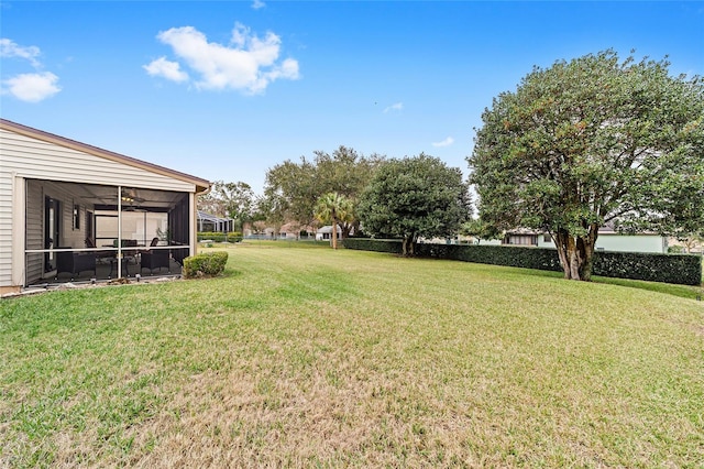 view of yard featuring a sunroom