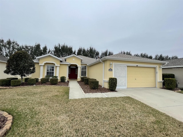 single story home featuring a garage and a front yard