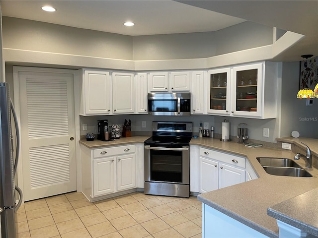 kitchen featuring white cabinetry, stainless steel appliances, and sink