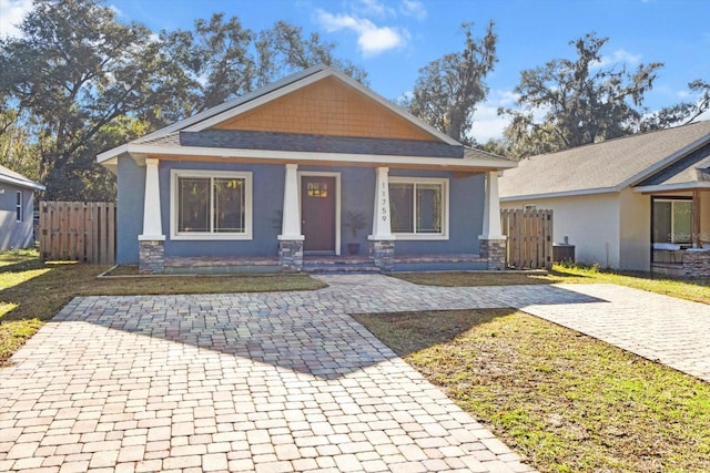 view of front of home featuring central AC unit and covered porch