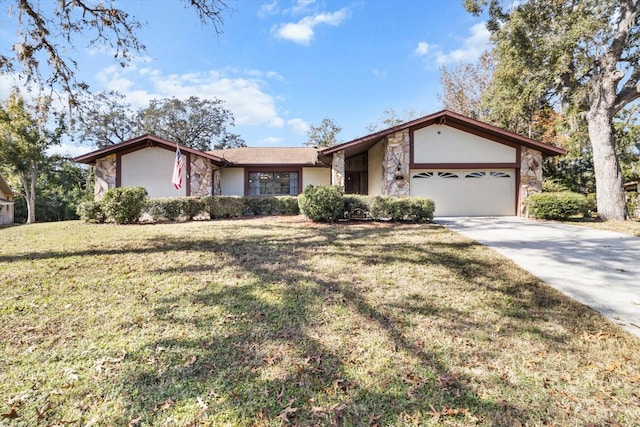 single story home with a garage and a front lawn