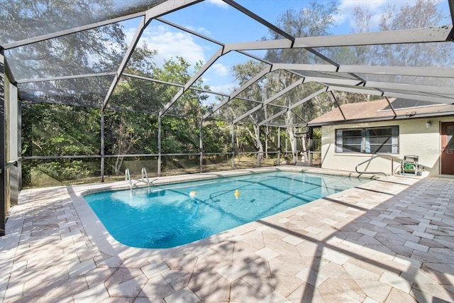 view of pool featuring a lanai and a patio