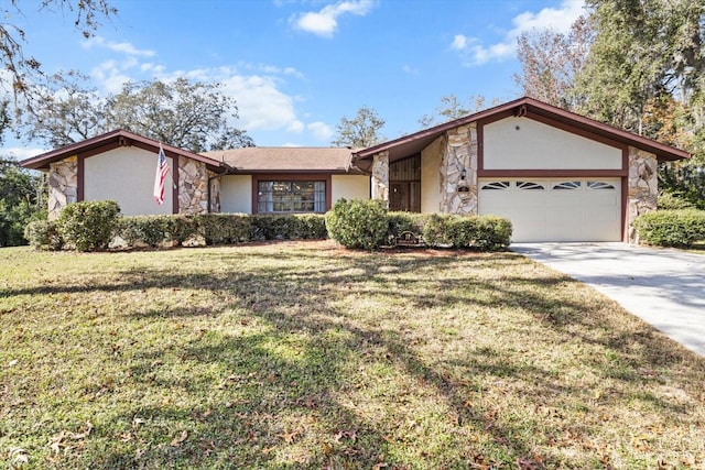 ranch-style house featuring a garage and a front lawn