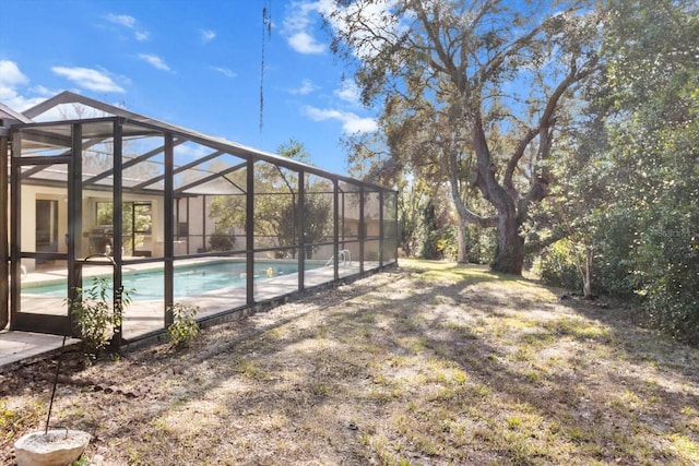 view of pool with a lanai