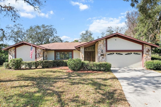 single story home featuring a garage and a front lawn