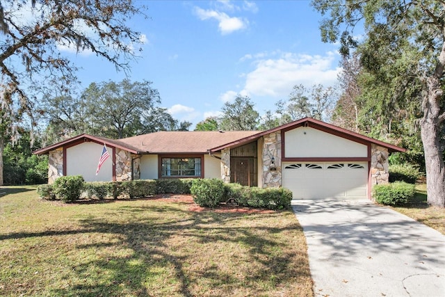 ranch-style home featuring a garage and a front yard