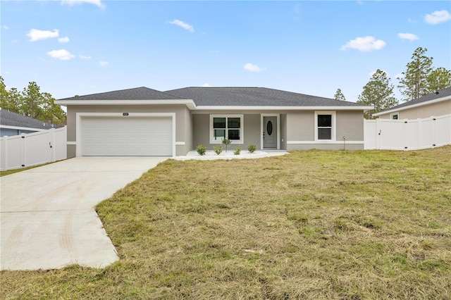 view of front of house featuring a garage and a front lawn