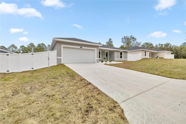 single story home featuring a garage and a front yard