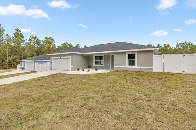 single story home with a garage and a front lawn