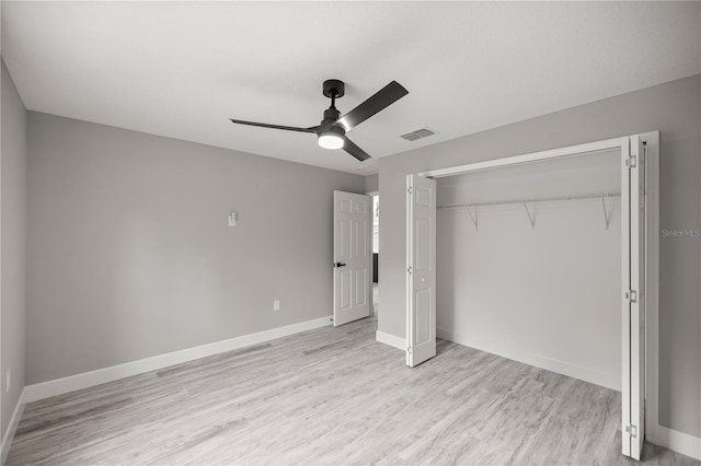 unfurnished bedroom featuring a closet, ceiling fan, and light wood-type flooring