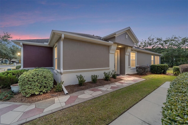 ranch-style house with a yard