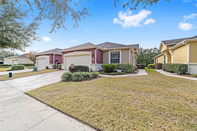 single story home featuring a garage and a front yard