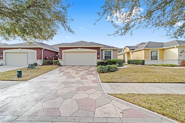 single story home with a garage and a front lawn