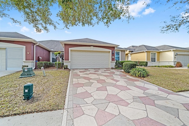 single story home with a garage and a front lawn