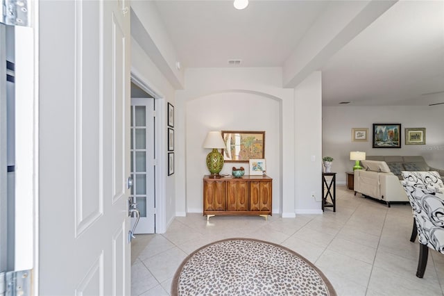 foyer entrance with light tile patterned floors