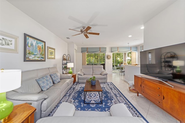 tiled living room with ceiling fan