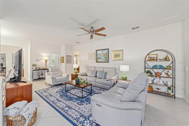 living room with light tile patterned floors and ceiling fan